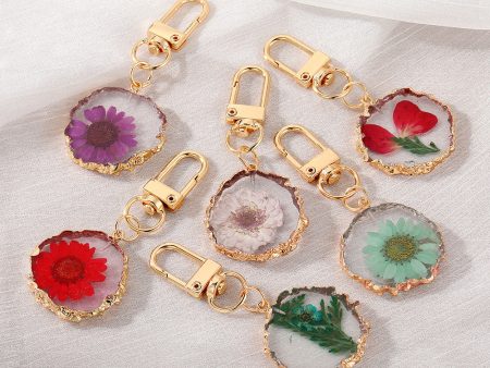 Wholesale Creative Frosted Epoxy Dried Flower December Flower Keychain on Sale