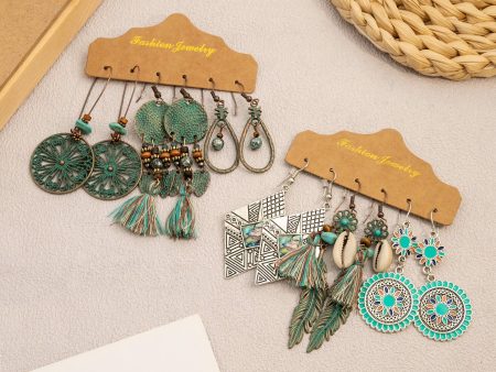 Wholesale Vintage Sunflower Feather Tassels Ethnic Style Round Hollow Alloy Earrings For Discount