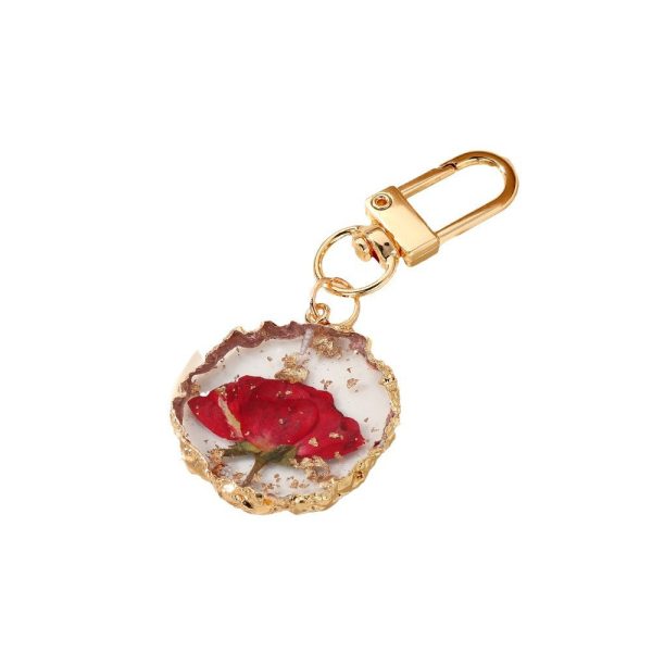 Wholesale Creative Frosted Epoxy Dried Flower December Flower Keychain on Sale