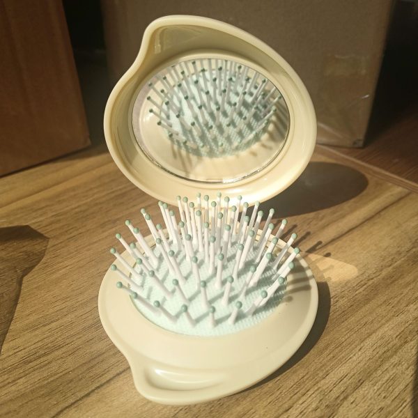 Wholesale ABS Droplet Shaped Cream Gel Folding Mirror Airbag Comb on Sale