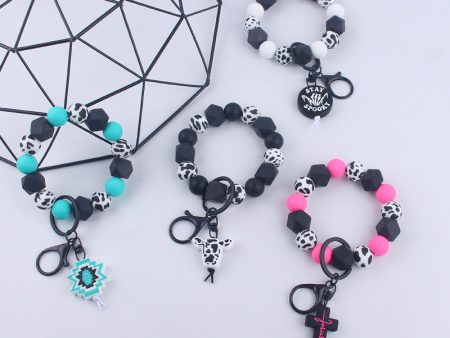 Wholesale Cartoon Bull Head Aztec Cross Silicone Beaded Wrist Keychain For Sale